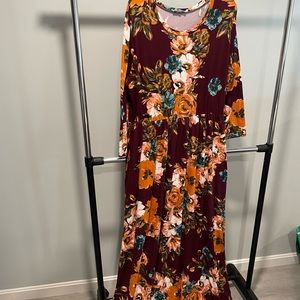 Beautiful long maroon, large flowered dress with pockets